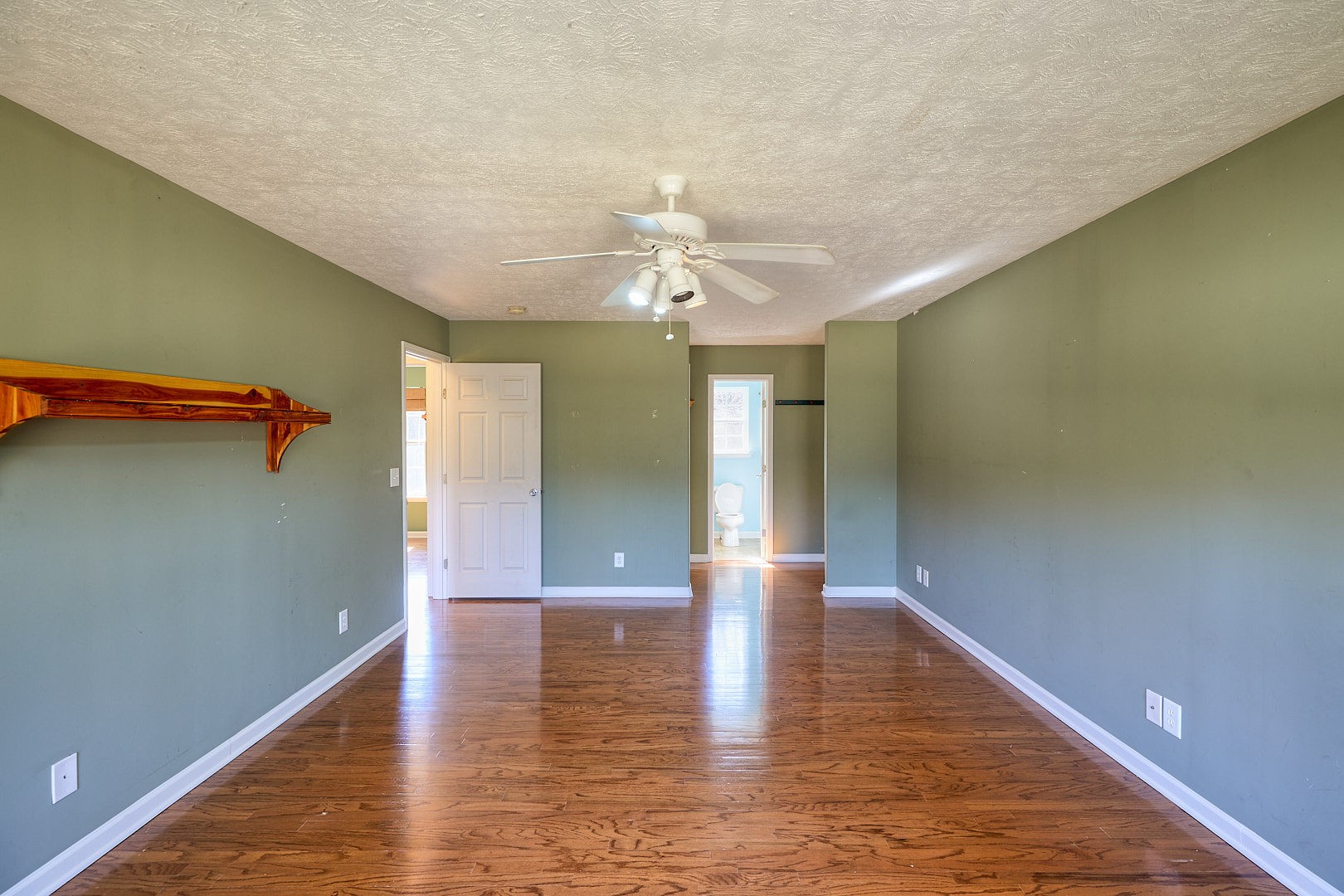 7042 Murfreesboro Road Lebanon, TN 37090 - Photo 28 of 43 a view of an empty room with window and wooden floor