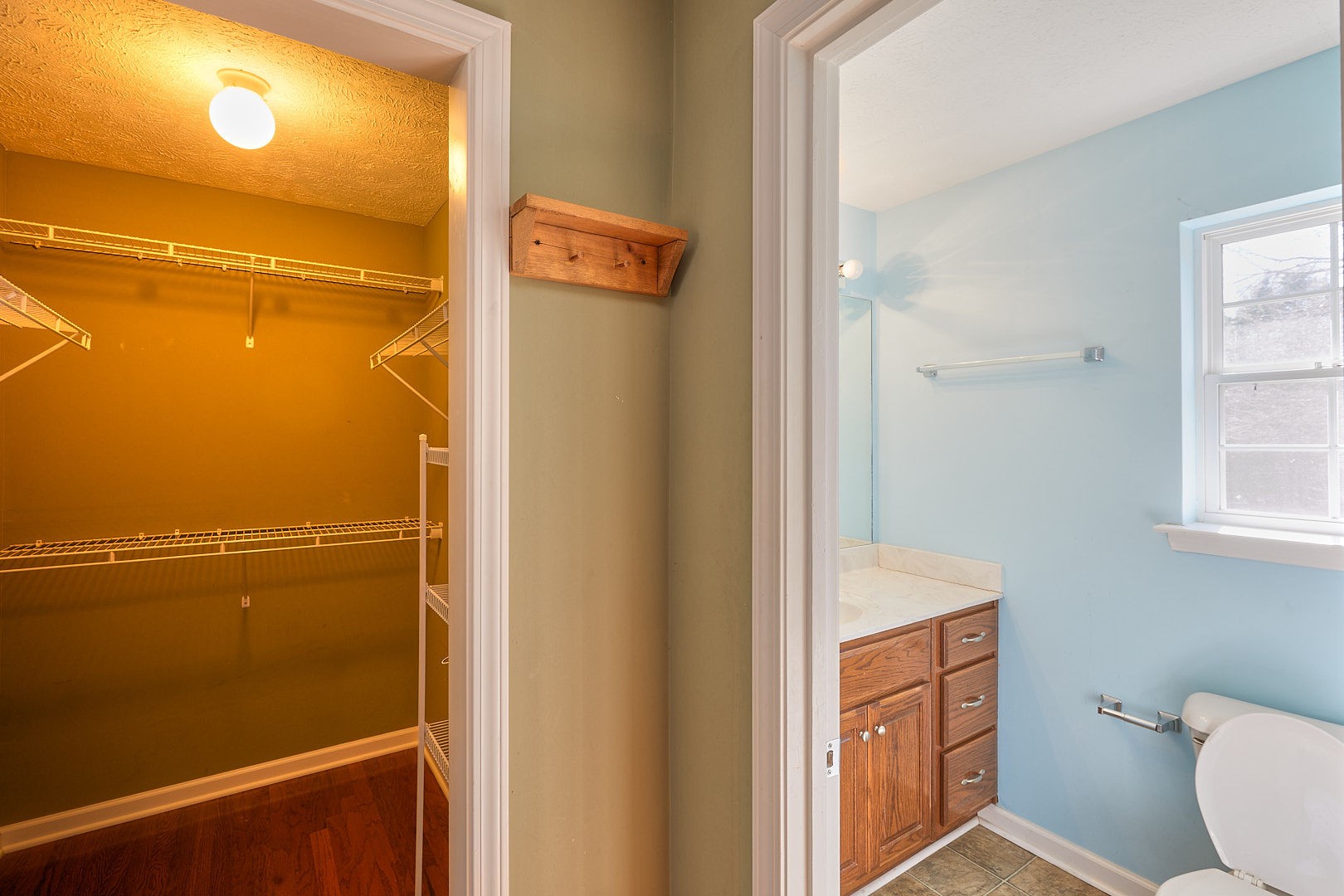 7042 Murfreesboro Road Lebanon, TN 37090 - Photo 30 of 43 a bathroom with a granite countertop sink and a mirror