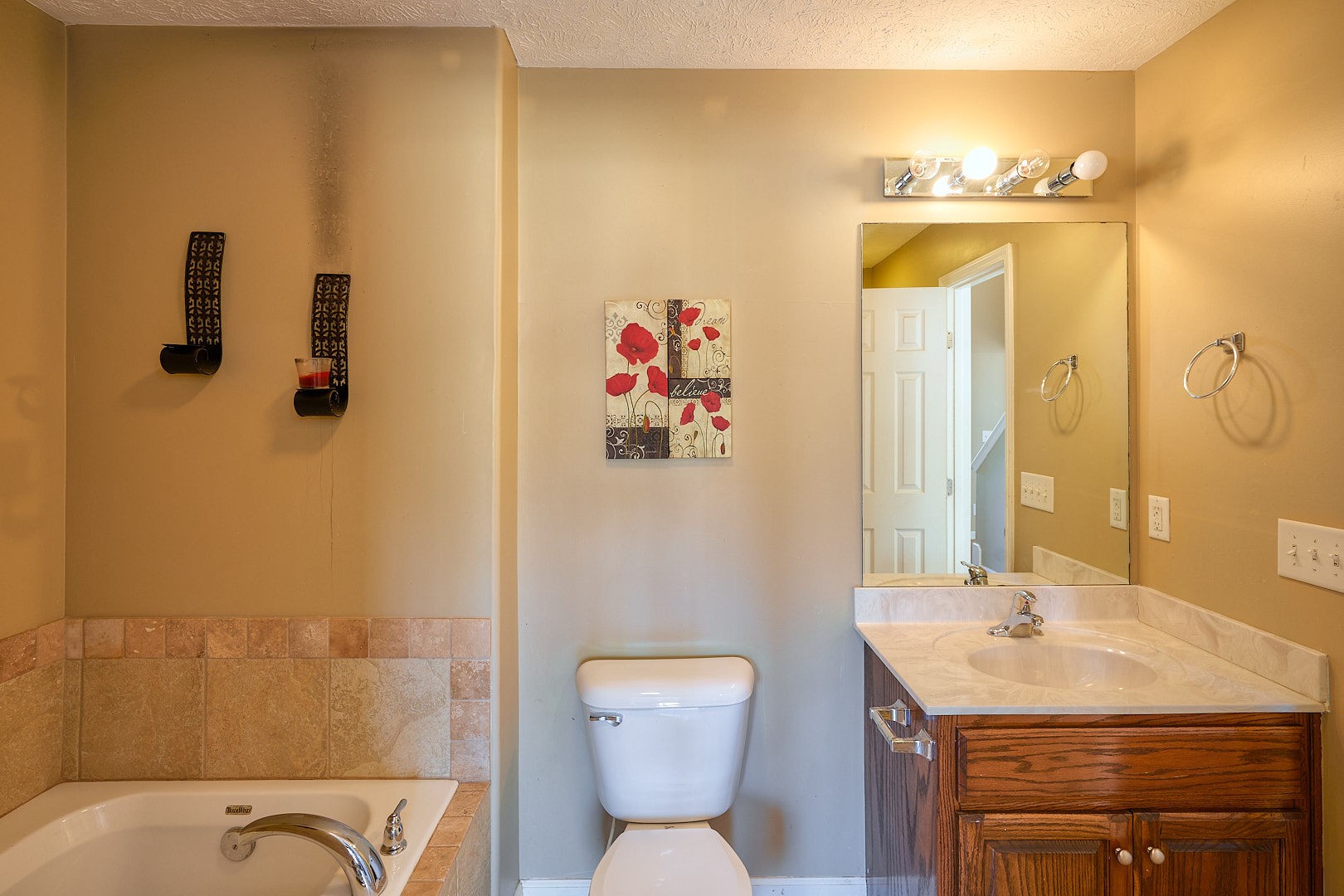 7042 Murfreesboro Road Lebanon, TN 37090 - Photo 33 of 43 a bathroom with a sink a toilet and shower
