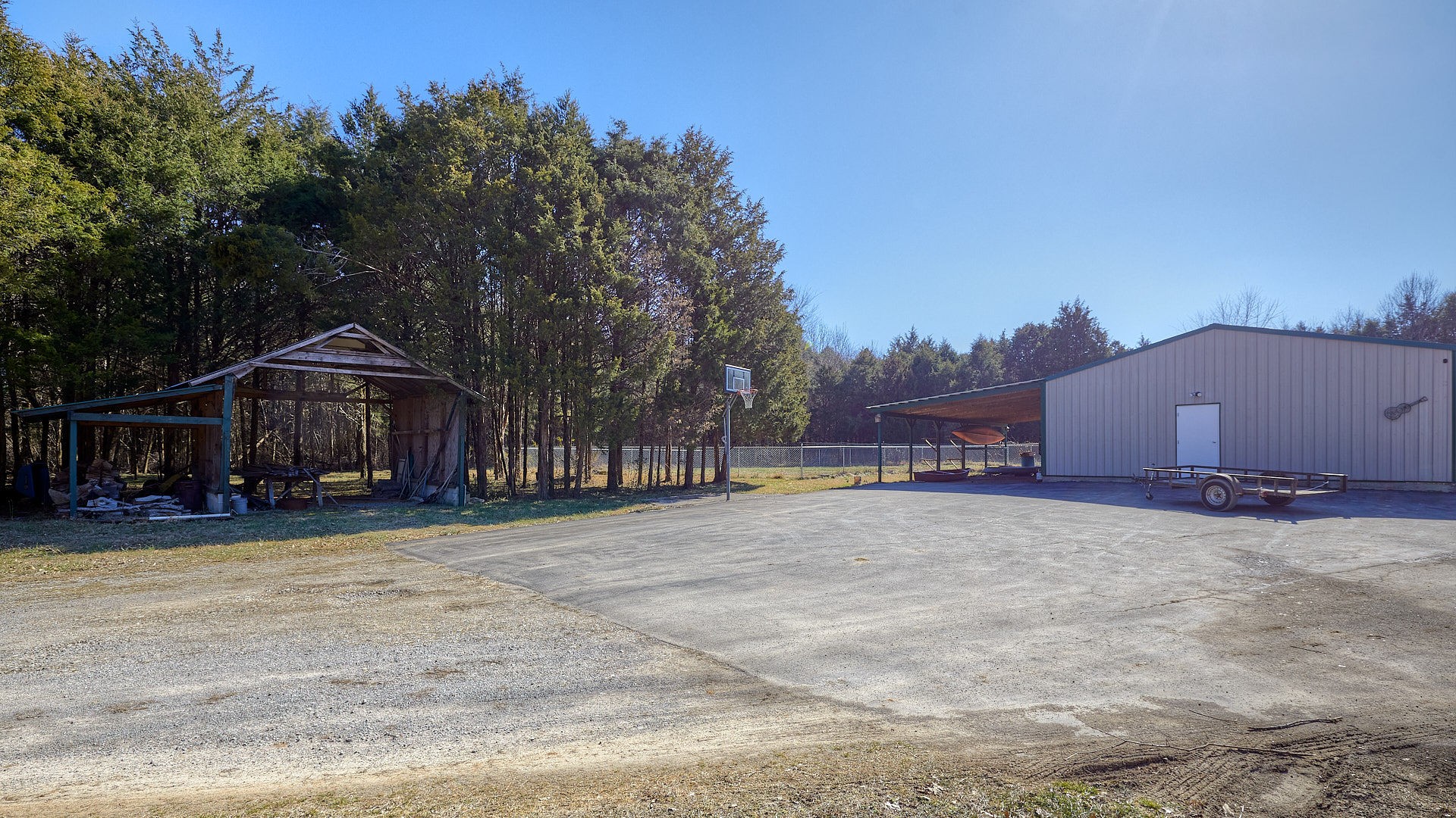 7042 Murfreesboro Road Lebanon, TN 37090 - Photo 40 of 43 a view of a house with a yard and a large tree