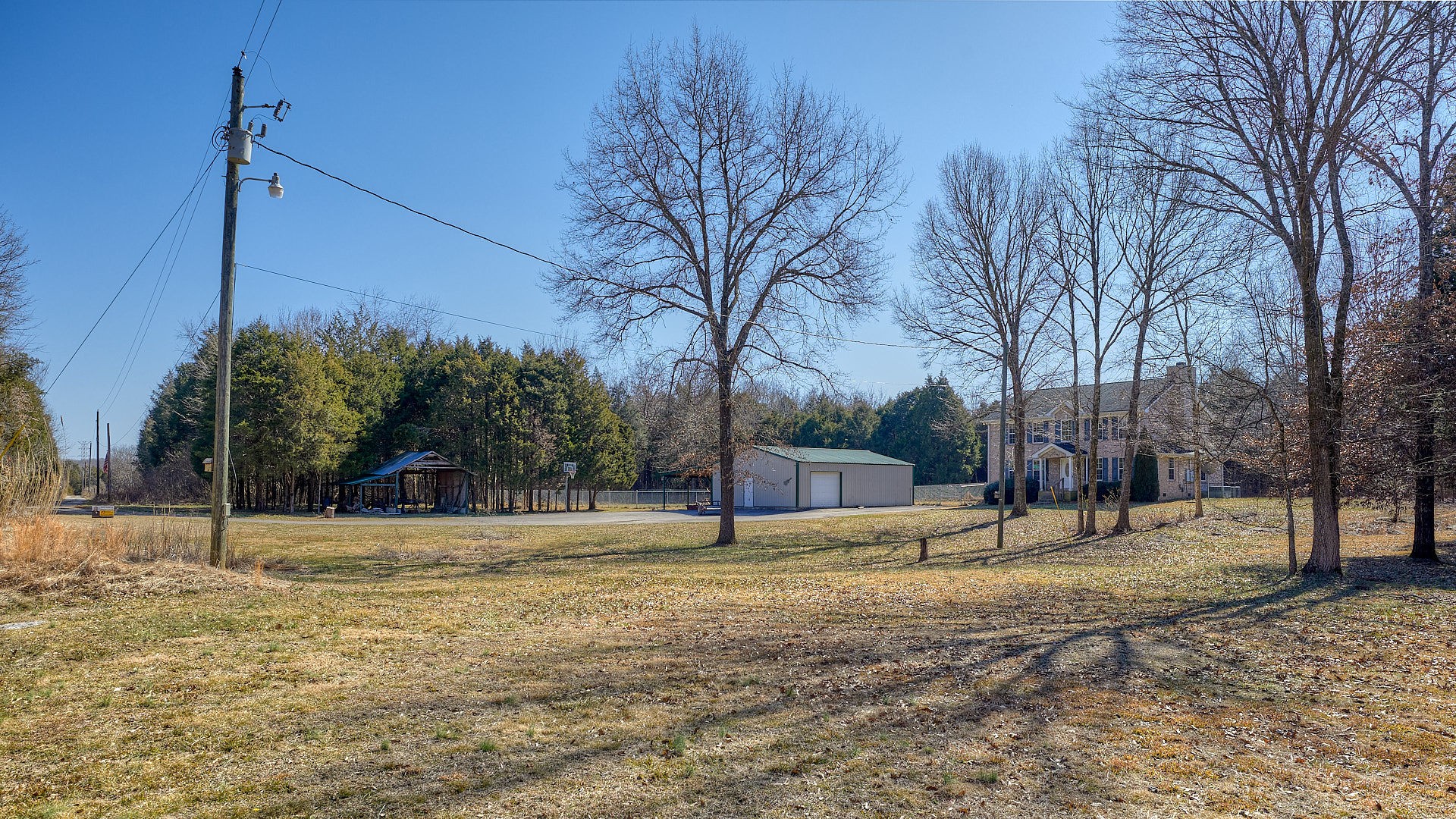 7042 Murfreesboro Road Lebanon, TN 37090 - Photo 41 of 43 a house with trees in the background