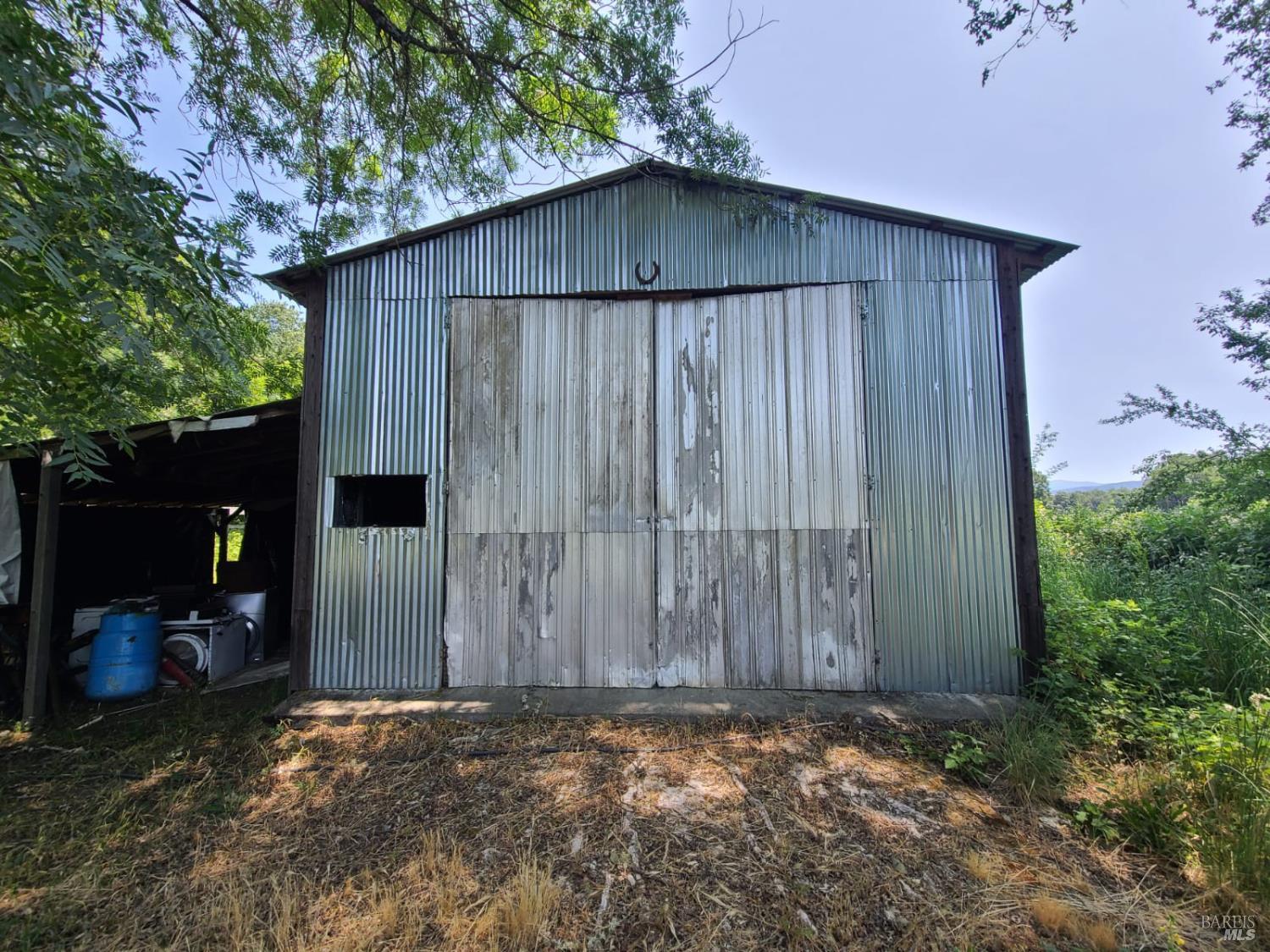 24450 Wattenburg Road Covelo, CA 95428 - Photo 8 of 11 a backyard of a house