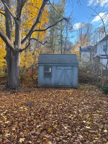 a view of an empty room with stairs and ventilation