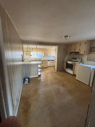 a bathroom with sink toilet and shower