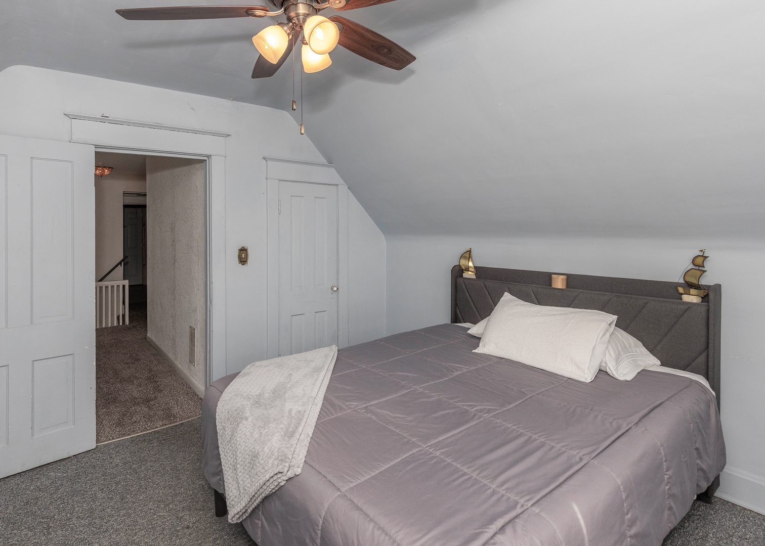 1839 15th Street Moline, IL 61265 - Photo 23 of 32 a bedroom with a bed and a chandelier