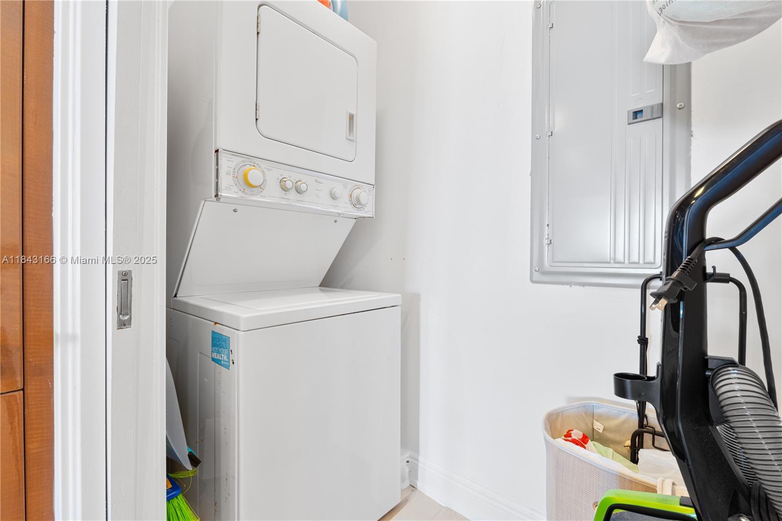 3801 Collins Avenue, Unit 1105 Miami Beach, FL 33140 - Photo 31 of 45 a utility room with dryer and washer