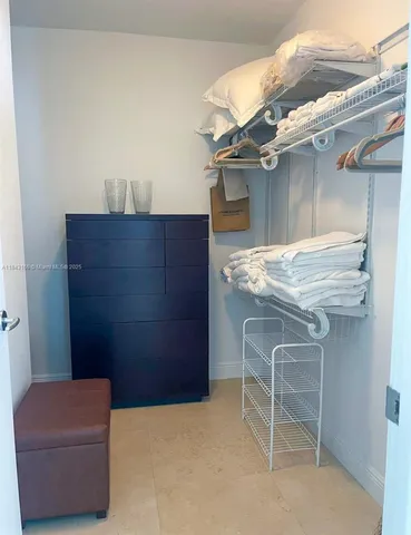 a view of a balcony with table and chairs