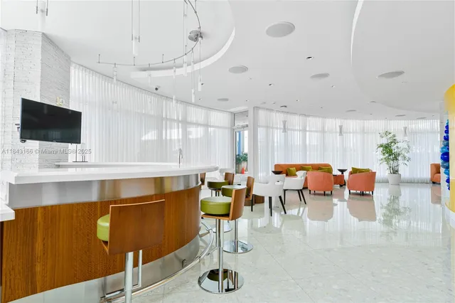 a view of wooden balcony with furniture and a window