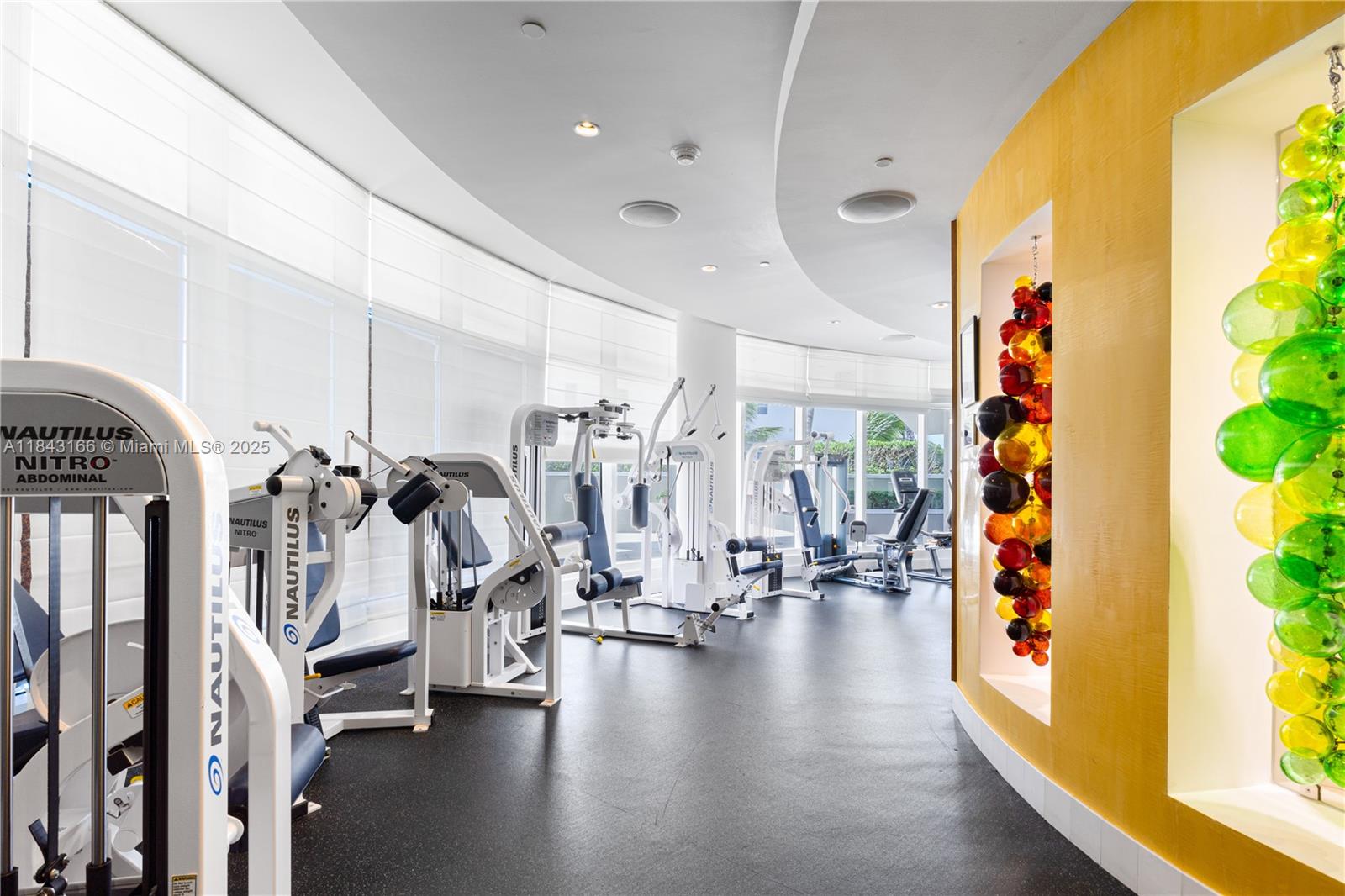 3801 Collins Avenue, Unit 1105 Miami Beach, FL 33140 - Photo 44 of 45 a view of a room with gym equipment