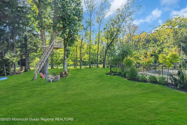a view of green field with trees
