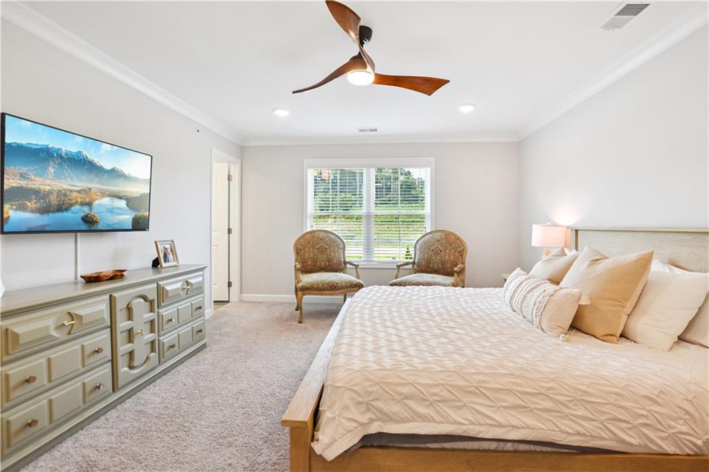 765 Trevett Way Marietta, GA 30066 - Photo 18 of 44 a bedroom with a bed and a flat screen tv