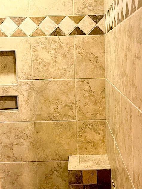 3913 100th Street Lubbock, TX 79423 - Photo 25 of 35 a bathroom with a bathtub and shower