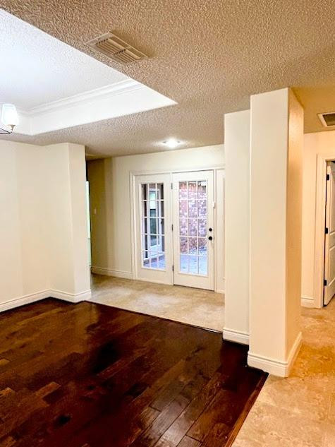 3913 100th Street Lubbock, TX 79423 - Photo 27 of 35 a view of an empty room with wooden floor and a window