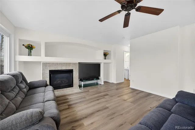 a living room with furniture and a fireplace