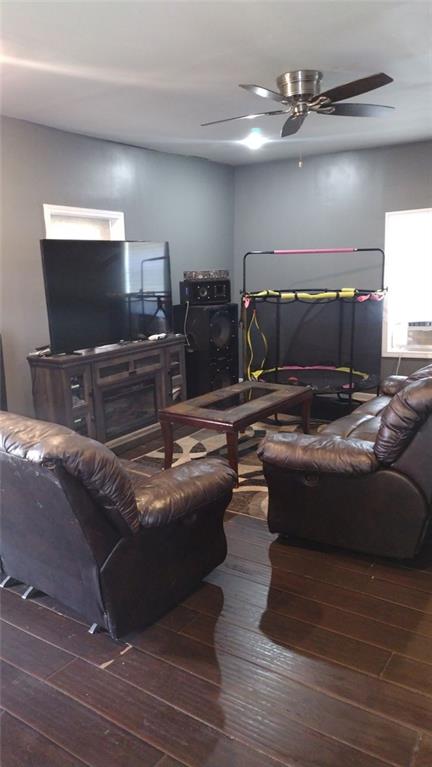 136 Hill Street Commerce, GA 30529 - Photo 9 of 27 a living room with furniture and a flat screen tv