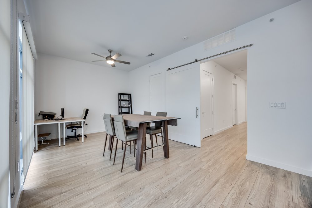 4801 Springdale Road, Unit 2107 Austin, TX 78723 - Photo 14 of 26 a view of a dining room with furniture and wooden floor