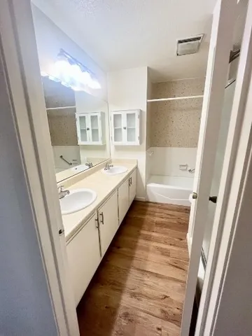 a bathroom with a bathtub sink and toilet