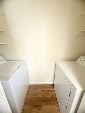 a view of a hallway with washer and dryer