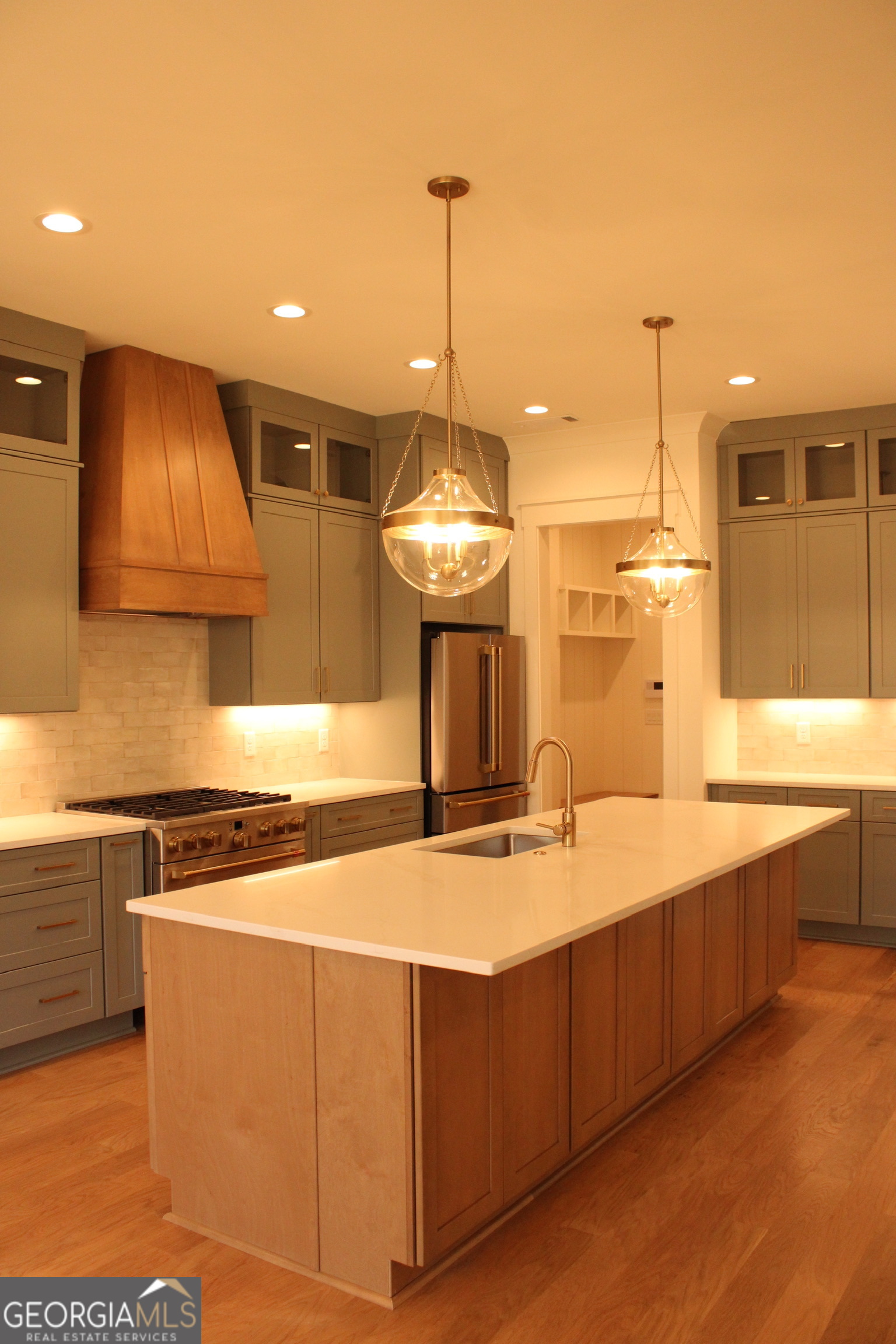 3.32 Ac Harp Road Fayetteville, GA 30215 - Photo 12 of 31 a kitchen with stainless steel appliances granite countertop a sink a stove and a wooden floors