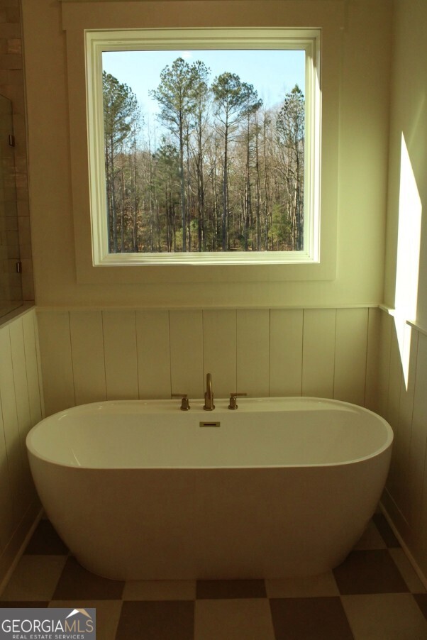 3.32 Ac Harp Road Fayetteville, GA 30215 - Photo 26 of 31 a bath tub sitting in a bathroom next to a window