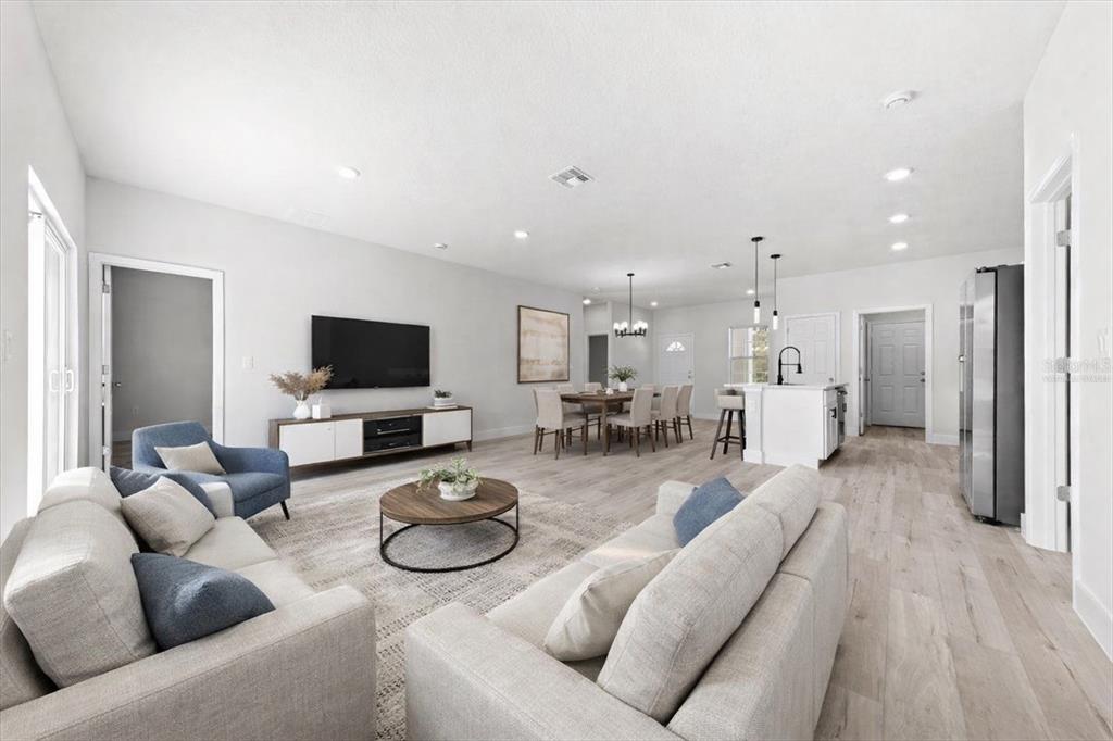 15495 Southwest 49th Avenue Road Ocala, FL 34473 - Photo 17 of 65 a living room with furniture and a flat screen tv