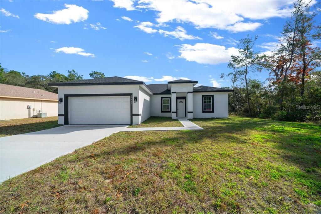 15495 Southwest 49th Avenue Road Ocala, FL 34473 - Photo 2 of 65 a swimming pool with outdoor seating and yard
