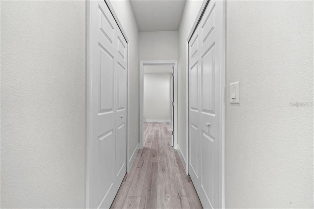 15495 Southwest 49th Avenue Road Ocala, FL 34473 - Photo 32 of 65 a view of a hallway with wooden floor