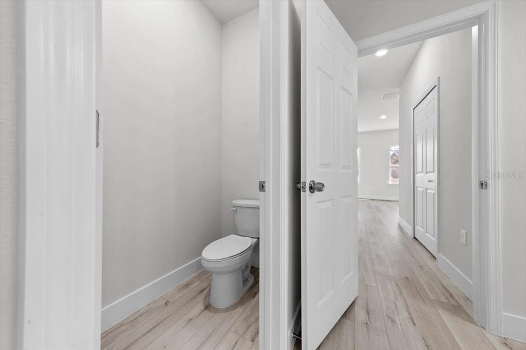 15495 Southwest 49th Avenue Road Ocala, FL 34473 - Photo 34 of 65 a bathroom with a shower toilet and sink