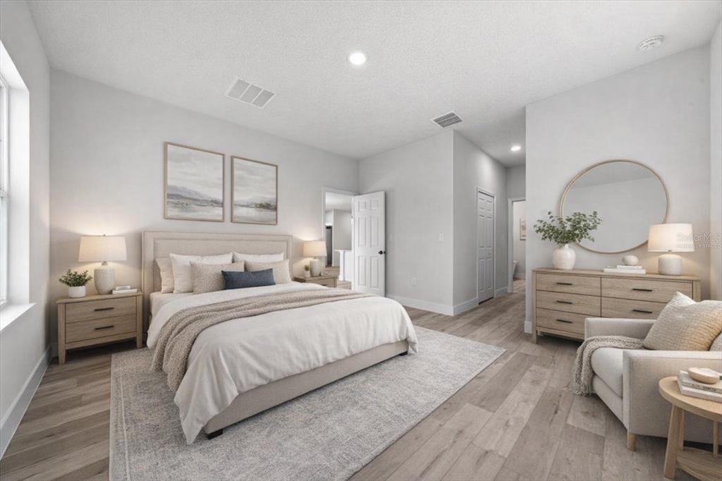 15495 Southwest 49th Avenue Road Ocala, FL 34473 - Photo 36 of 65 a bedroom with a bed and wooden floor