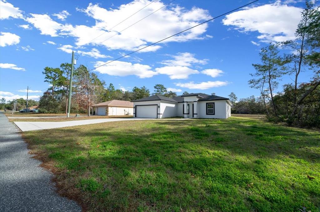 15495 Southwest 49th Avenue Road Ocala, FL 34473 - Photo 54 of 65 a view of a house with a yard