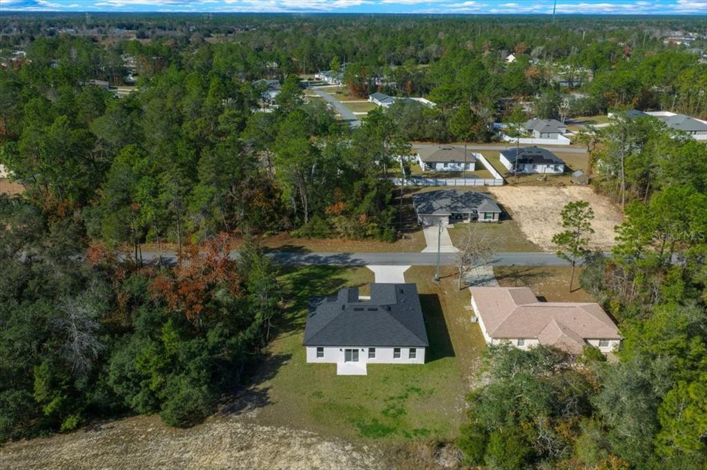 15495 Southwest 49th Avenue Road Ocala, FL 34473 - Photo 55 of 65 an aerial view of a house with a yard