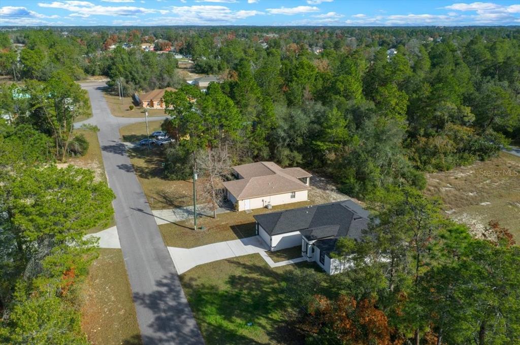 15495 Southwest 49th Avenue Road Ocala, FL 34473 - Photo 56 of 65 a view of a house with a yard and sitting area