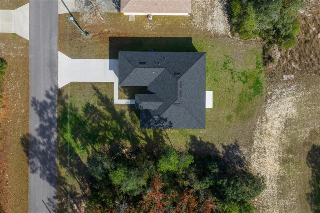 15495 Southwest 49th Avenue Road Ocala, FL 34473 - Photo 59 of 65 an aerial view of a house with a yard