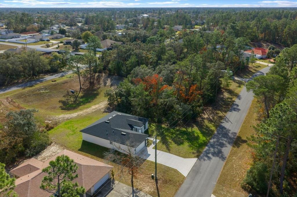 15495 Southwest 49th Avenue Road Ocala, FL 34473 - Photo 60 of 65 an aerial view of a house with a yard