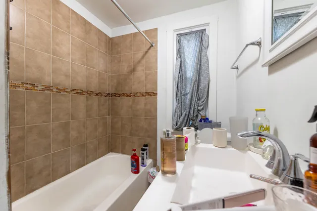 a bathroom with a bathtub and shower