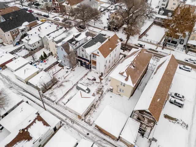 a view of a house with a white bed
