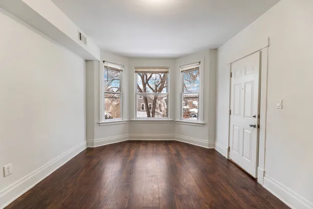 a view of livingroom with hardwood floor and window