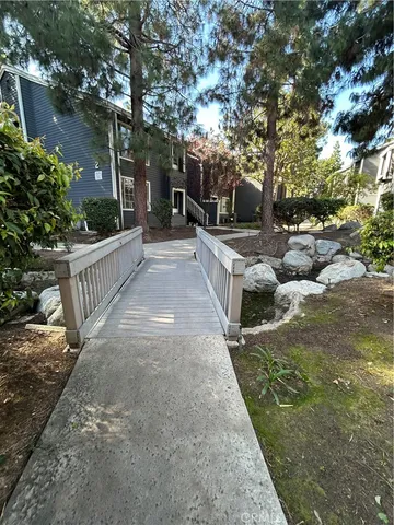 a view of a garden with wooden fence