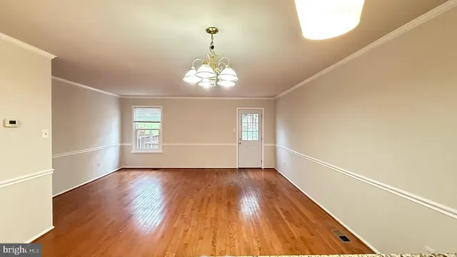 a view of livingroom with hardwood floor and window