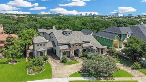 an aerial view of a house with yard swimming pool and outdoor seating