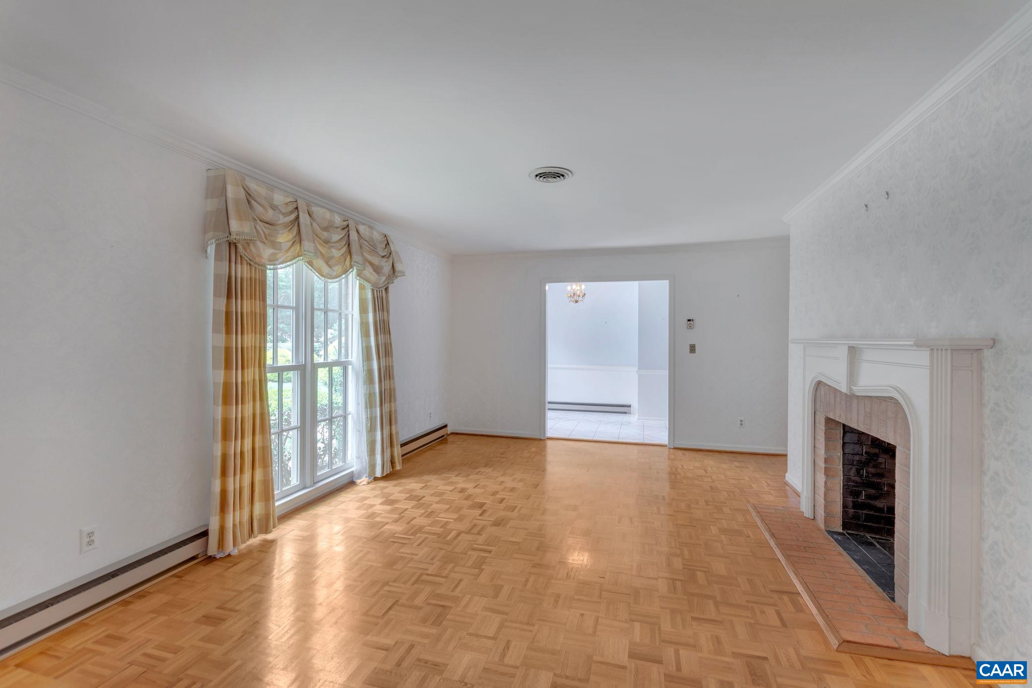 314 Westminster Road Charlottesville, VA 22901 - Photo 7 of 49 a view of an empty room with a fireplace and a window