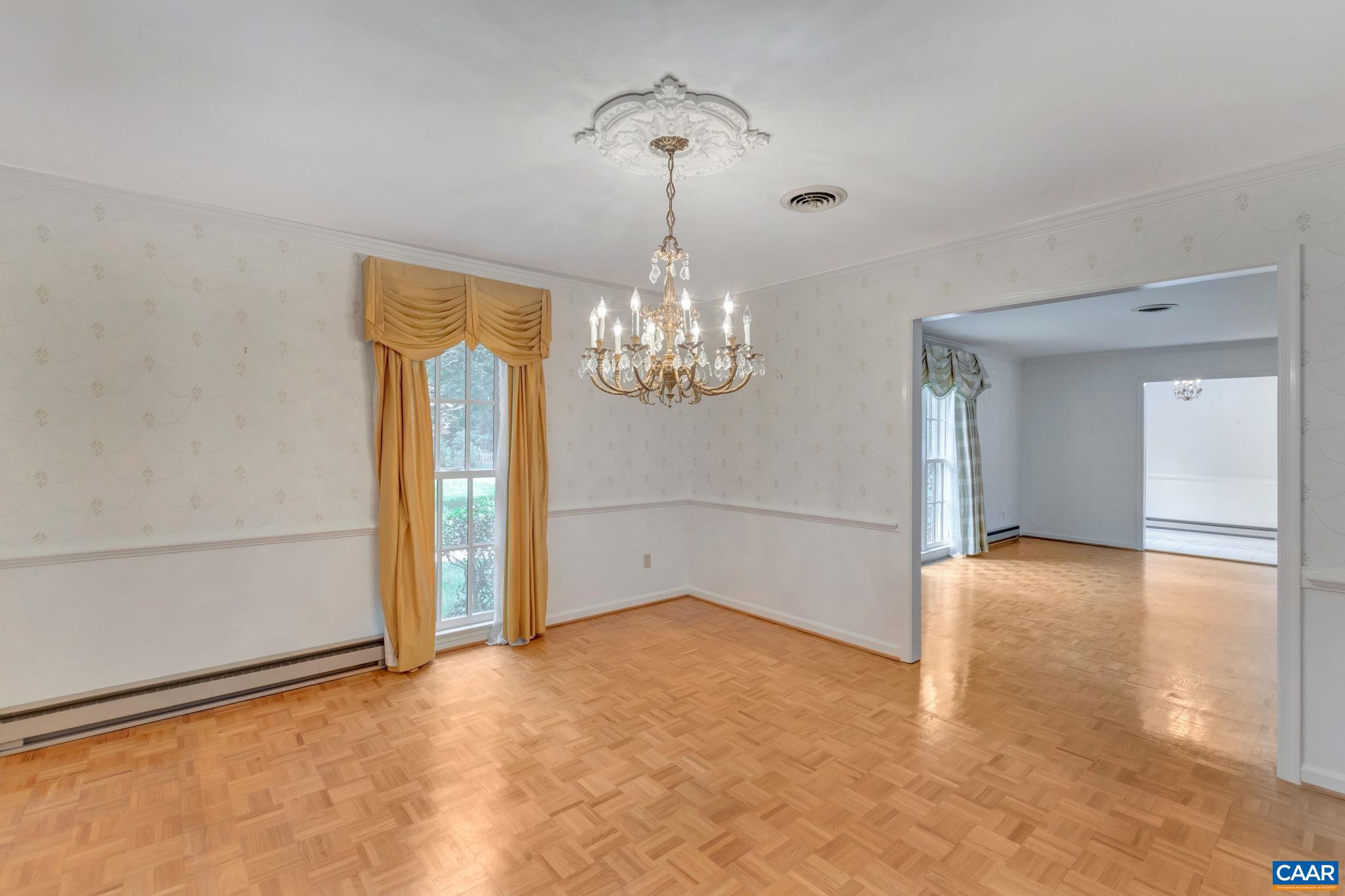314 Westminster Road Charlottesville, VA 22901 - Photo 10 of 49 a view of an empty room with chandelier and a window