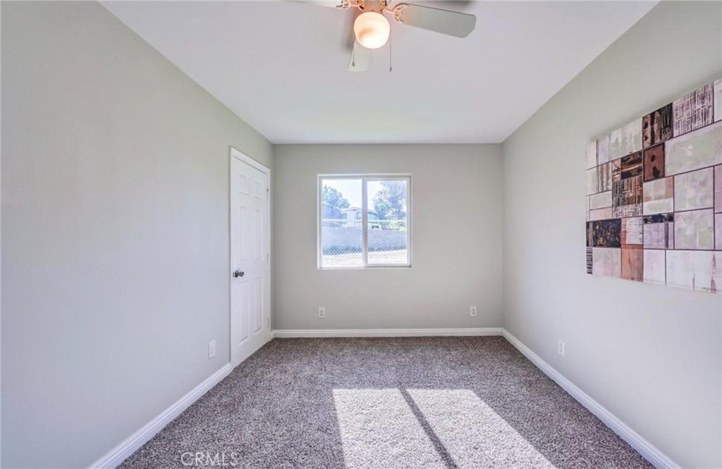 5510 Bushnell Avenue Riverside, CA 92505 - Photo 5 of 8 an empty room with windows