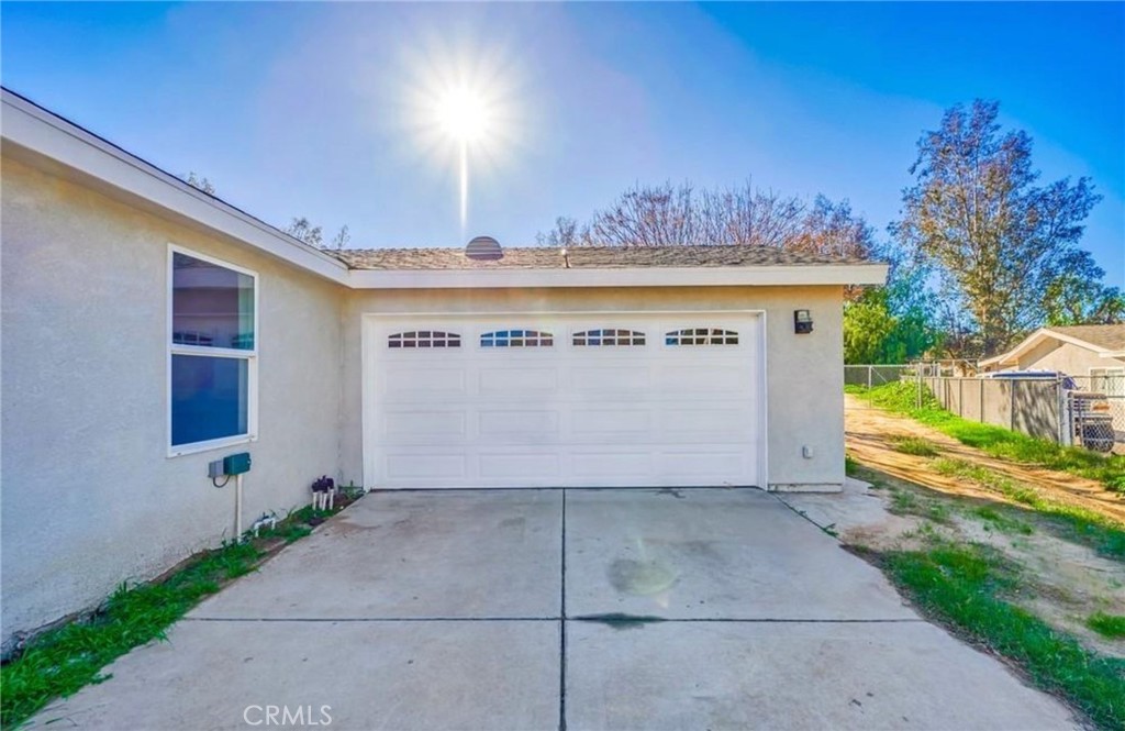 5510 Bushnell Avenue Riverside, CA 92505 - Photo 8 of 8 a view of a house with a yard and a garage