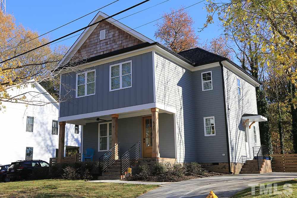 521 Bart Street Raleigh, NC 27610 - Photo 1 of 29 a front view of a house with a yard
