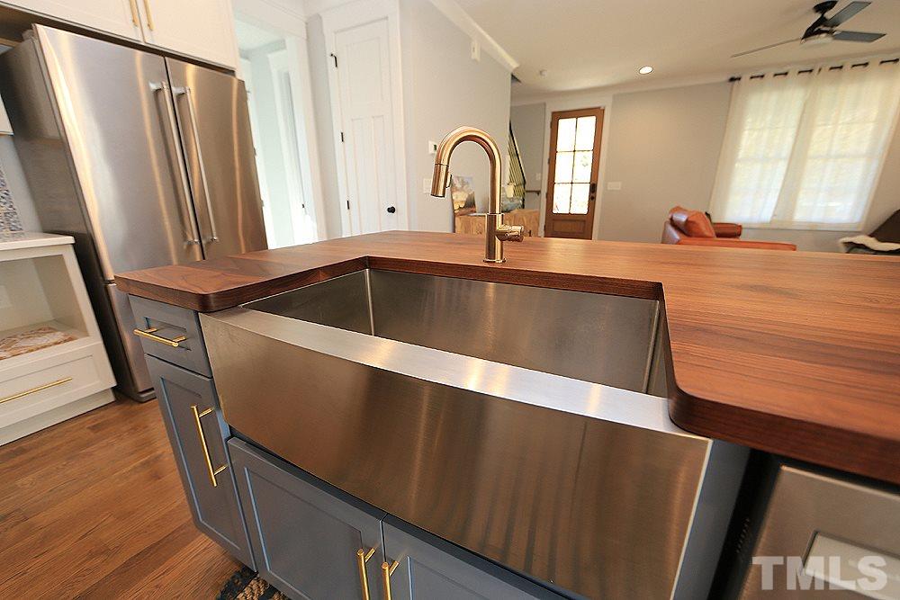 521 Bart Street Raleigh, NC 27610 - Photo 14 of 29 a close view of sink and mirror with outdoor space