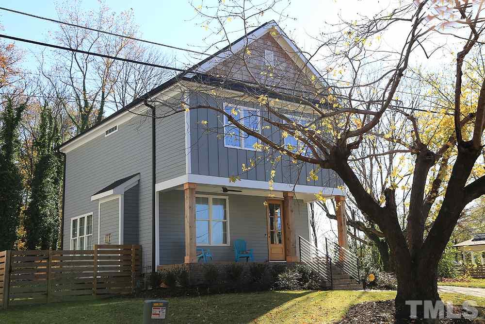 521 Bart Street Raleigh, NC 27610 - Photo 3 of 29 a view of a white house with a large tree