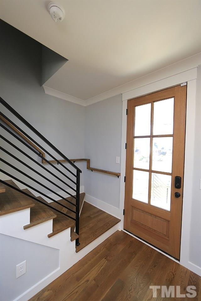 521 Bart Street Raleigh, NC 27610 - Photo 4 of 29 wooden floor in an empty room with a window