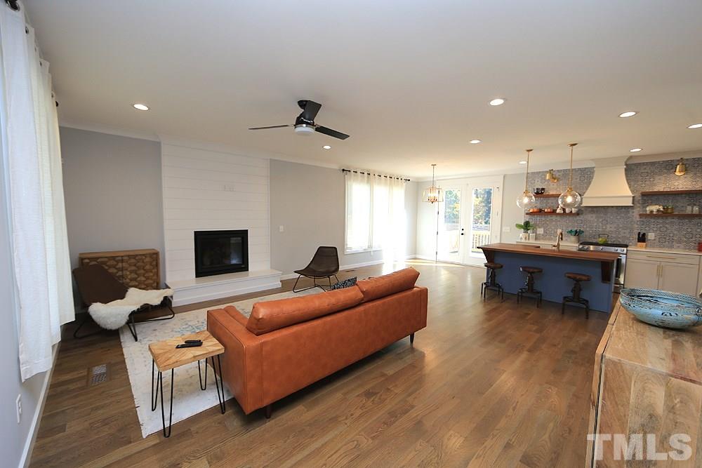 521 Bart Street Raleigh, NC 27610 - Photo 5 of 29 a living room with furniture and a flat screen tv