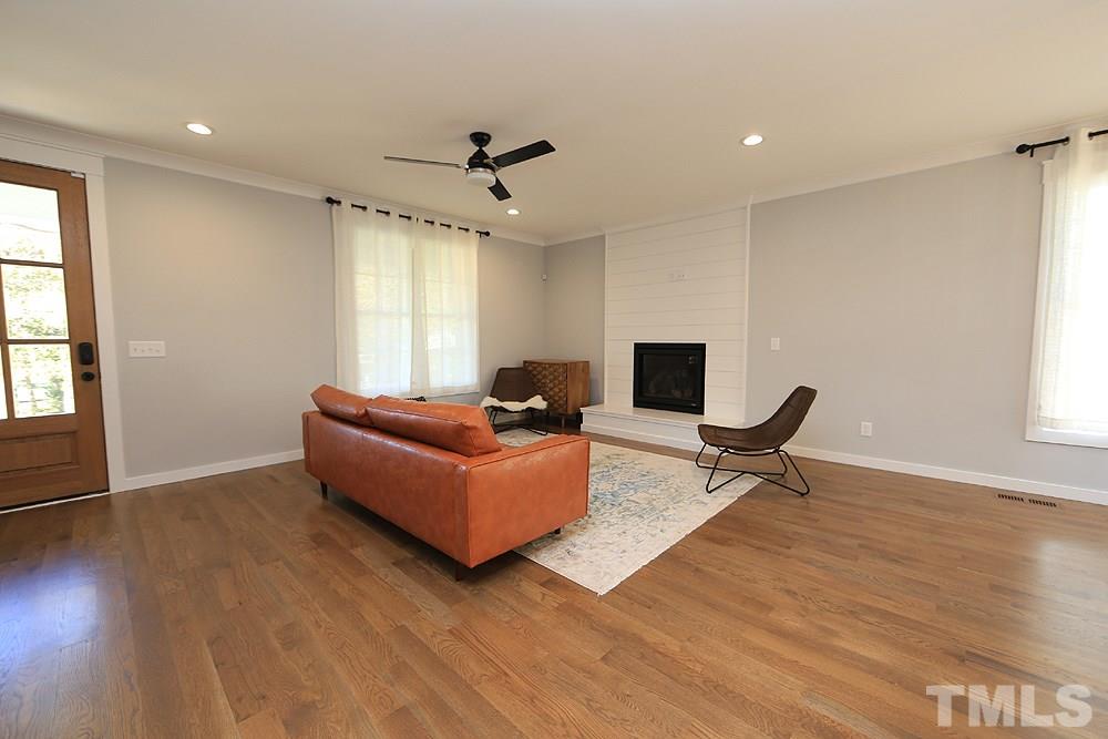 521 Bart Street Raleigh, NC 27610 - Photo 6 of 29 a living room with furniture and a fireplace